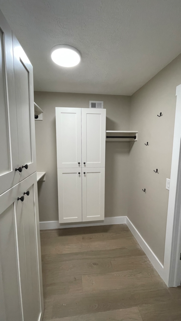 Custom Closet Shaker Cabinets with accessory hooks and tall hanging